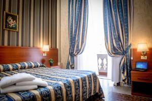 Postel nebo postele na pokoji v ubytování Hotel Emmaus