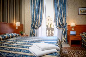 Postel nebo postele na pokoji v ubytování Hotel Emmaus