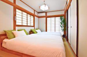 Kama o mga kama sa kuwarto sa MATCHA HOUSE -Free Parking-