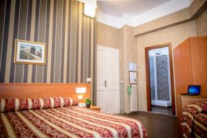 Postel nebo postele na pokoji v ubytování Hotel Emmaus