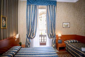 Postel nebo postele na pokoji v ubytování Hotel Emmaus