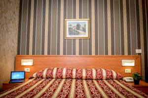 Postel nebo postele na pokoji v ubytování Hotel Emmaus