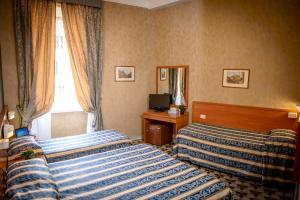 Postel nebo postele na pokoji v ubytování Hotel Emmaus