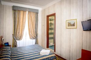 Postel nebo postele na pokoji v ubytování Hotel Emmaus