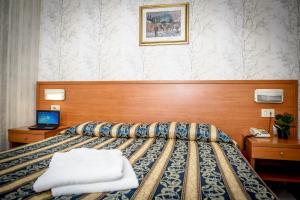 Postel nebo postele na pokoji v ubytování Hotel Emmaus