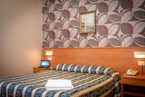 Postel nebo postele na pokoji v ubytování Hotel Emmaus