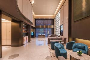 Posezení v ubytování Guangzhou Olympic Sports Centre Financial City Crystal Orange Hotel