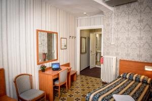 Postel nebo postele na pokoji v ubytování Hotel Emmaus