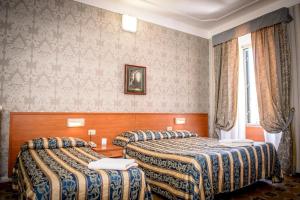 Postel nebo postele na pokoji v ubytování Hotel Emmaus