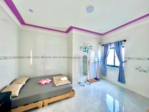 Ένα ή περισσότερα κρεβάτια σε δωμάτιο στο Homestay 1996 cơ sở 2