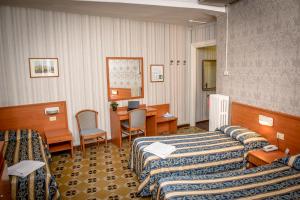 Postel nebo postele na pokoji v ubytování Hotel Emmaus