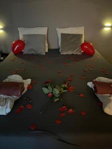 a bedroom with a bed with hearts on the floor at Erholung im Privaten SPA in Esslingen