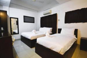 Postel nebo postele na pokoji v ubytování AZYA Hotel