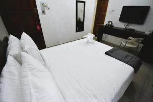 Postel nebo postele na pokoji v ubytování AZYA Hotel