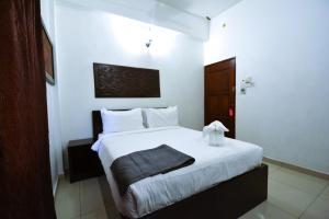 Postel nebo postele na pokoji v ubytování AZYA Hotel