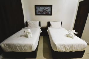 Postel nebo postele na pokoji v ubytování AZYA Hotel
