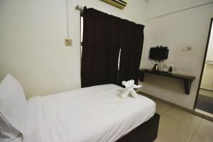 Postel nebo postele na pokoji v ubytování AZYA Hotel