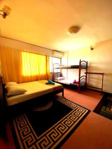 a bedroom with a bed and a bunk bed at Mentari View Homestay in Port Dickson +11 photos