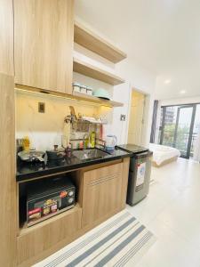 a kitchen with a sink and a counter top at 501 Modern Studio with Balcony & Kitchen in Ho Chi Minh City +7 photos