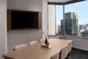 a conference room with a table and a flat screen tv at ANA InterContinental Tokyo by IHG in Tokyo