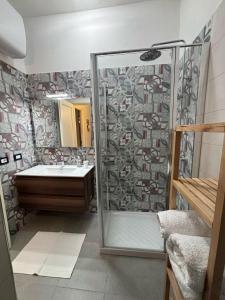 a bathroom with a shower and a sink at Casa Marina Taormina in Taormina