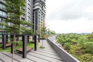 an apartment balcony with a view of a building at The Makcik's Homestay at Almyra Residence in Kajang