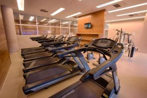 a row of exercise bikes in a gym at Fusion Hplus Express + in Brasília