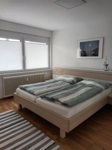 Postel nebo postele na pokoji v ubytování Appartement Kärntner Seenland