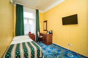 Postel nebo postele na pokoji v ubytování Hotel Otakar