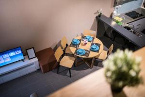 a model of a dining room with a table and chairs at Bangsar LRT Suites EST by LSA in Kuala Lumpur