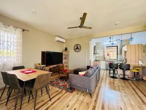 a living room with a couch and a table at Lakeview Bellemare Villa in Belle Mare