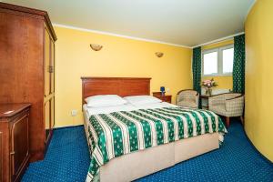 Postel nebo postele na pokoji v ubytování Hotel Otakar
