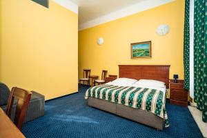 Postel nebo postele na pokoji v ubytování Hotel Otakar