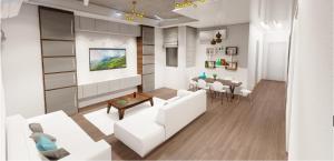 a living room with a white couch and a table at Nine House in Male City