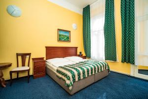 Postel nebo postele na pokoji v ubytování Hotel Otakar + 37 fotografií