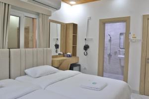 Postel nebo postele na pokoji v ubytování Darunique Inn