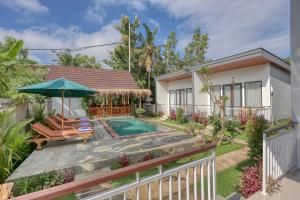 a villa with a swimming pool and a house at Nusa Dewata Cottage in Nusa Penida
