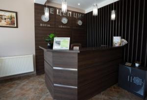 a reception desk in a room with wood at Hotel Velista in Voneshta Voda +43 photos