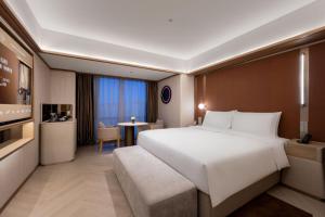 Katil atau katil-katil dalam bilik di Orange Crystal Hotel MixC Shantou East Coast