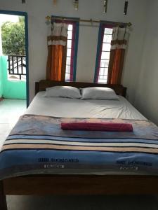 Postel nebo postele na pokoji v ubytování bulan homestay