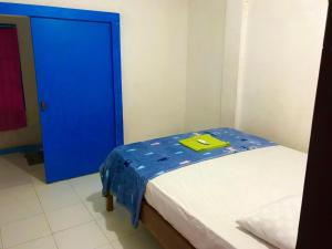 Postel nebo postele na pokoji v ubytování bulan homestay