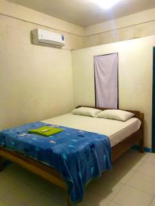 Postel nebo postele na pokoji v ubytování bulan homestay