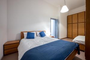 Ένα ή περισσότερα κρεβάτια σε δωμάτιο στο My Holidays Ghislanzoni