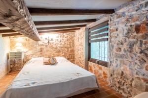 Ένα ή περισσότερα κρεβάτια σε δωμάτιο στο Maison - Les Bergeries de Danielle