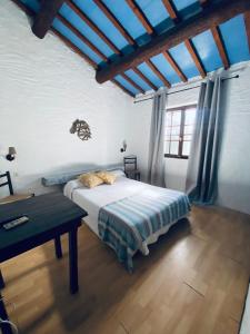 Postel nebo postele na pokoji v ubytování Hôtel MAS DE LAYALLE