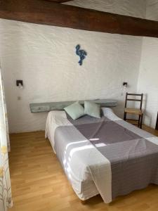 Postel nebo postele na pokoji v ubytování Hôtel MAS DE LAYALLE