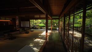 an inside view of a building with a room with windows at KAWAZU Gastronomy & Traditional Inn in Mashizume