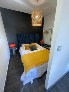 Łóżko lub łóżka w pokoju w obiekcie Villa Elena - Studio proche plage avec terrasse