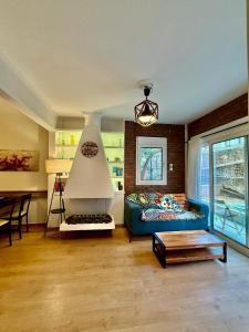 a living room with a couch and a table at XiangBaLa in Athens