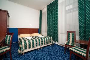 Postel nebo postele na pokoji v ubytování Hotel Czechia